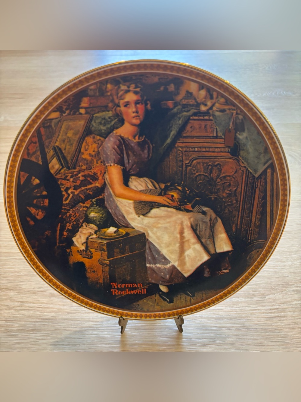 Norman Rockwell “Dreaming in the Attic” gold collector plate. Perfect condtion
